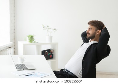 Relaxed Successful Businessman In Suit Enjoying Office Break Holding Hands Behind Head At Workplace, Calm Happy Ceo Meditating Or Relaxing Breathing Air With Eyes Closed Feeling No Stress At Work