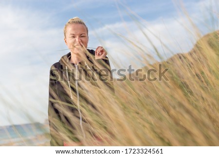 Similar – Portrait of a young woman on the beach