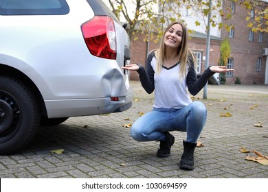 Relaxed Woman With Her Damaged Car