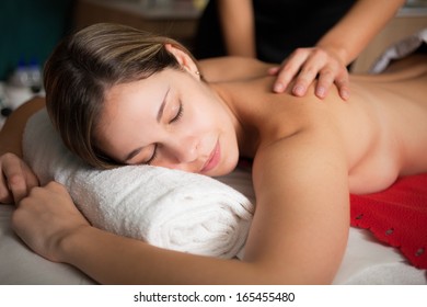 Relaxed woman receiving a massage
