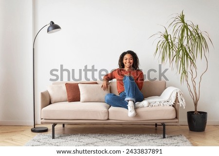 Similar – Image, Stock Photo Young beautiful woman sits inside window frame