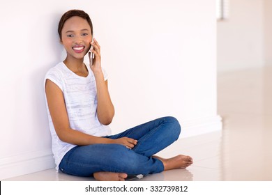 Relaxed Young Black Woman Talking On Cell Phone