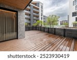 Relaxing Area on Wooden Deck and Terrace. Empty Balcony or Veranda in a Modern House or Apartment. Wide Angle