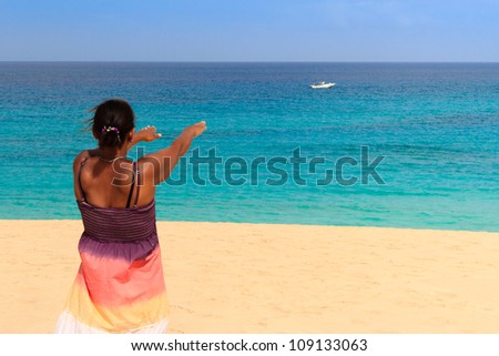 relaxing beach womanlook at a boat