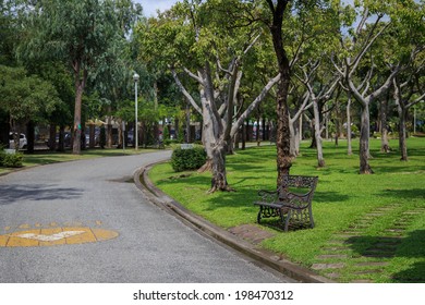 relaxing bench, chair, stool beside walkway in the public park, wait for resting people