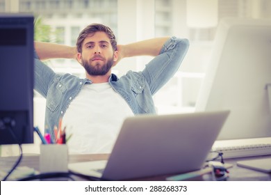 Relaxing businessman lying in chair in the office - Shutterstock ID 288268373