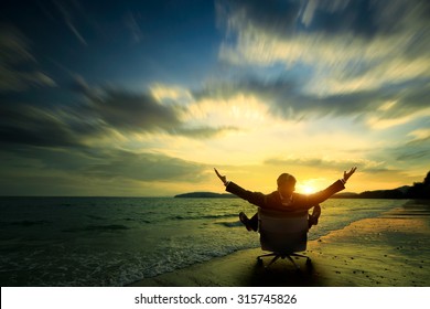 Relaxing businessman sitting on beach, Success in business concept - Powered by Shutterstock