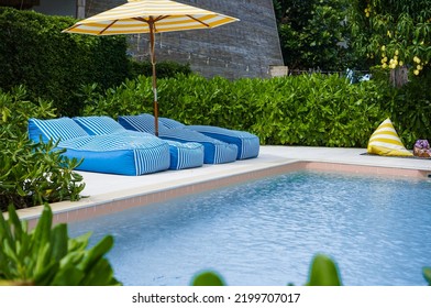 Relaxing Chairs Beside Of Swimming Pool. Lazy Chair By The Pool.