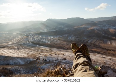 Relaxing With Crossed Legs Looking At Mountain Landscape On Winter Time 