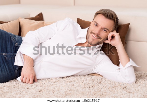 Relaxing Home Cheerful Young Man Lying Stock Photo Edit Now