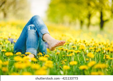 Relaxing lying in a meadow in summer sunshine