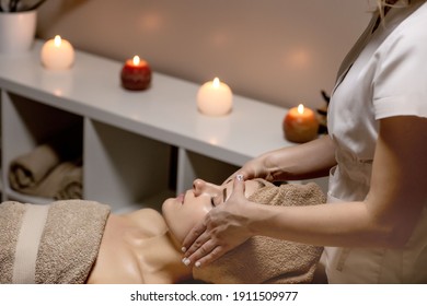 Relaxing massage. Woman receiving head massage at spa salon, side view. - Shutterstock ID 1911509977