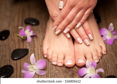 Relaxing Pink Manicure And Pedicure With A Orchid Flower