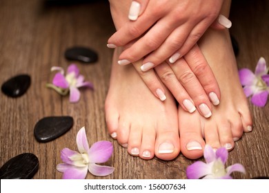 Relaxing Pink Manicure And Pedicure With A Orchid Flower