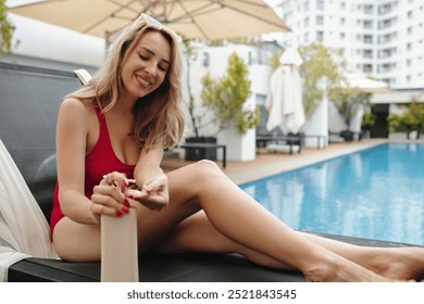 Relaxing Poolside in Red Swimsuit Smiling Contentedly - Powered by Shutterstock