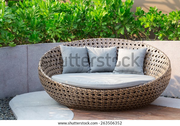 Relaxing Rattan Sofa In The\
Garden