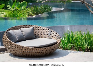 Relaxing Rattan Sofa At Swimming Pool