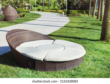 Relaxing Rattan Sunbed In A Green Exotic Garden