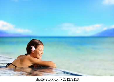 Relaxing Woman In Luxury Hotel Pool On Holidays Vacation Travel. Asian Young Female Person Enjoying In Pool Spa At Hotel Resort In An Exotic Paradise Getaway.