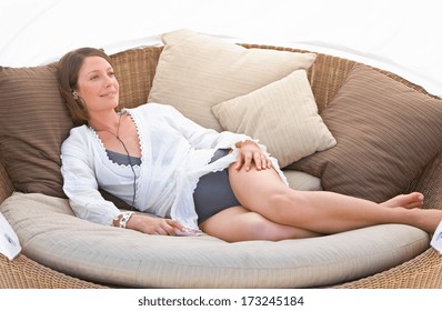 Relaxing Woman Sitting Comfortable In Sofa Lounge Chair 