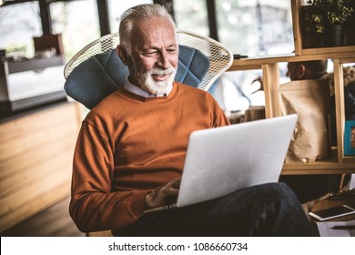 Relaxing and working at home. Senior businessman.  - Shutterstock ID 1086660734