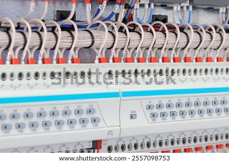 A relay module for controlling electrical loads over a data bus. Soft focus. 