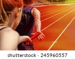 Relay race handing over from woman to man