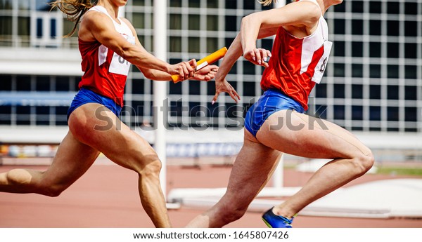 Relay Race Passing Baton Women Athletes Stock Photo 1645807426 ...