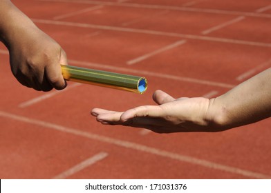 Relay-athletes hands sending action 