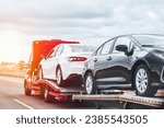 Reliable Towing and Recovery Services: 24-7 Assistance for Vehicle Breakdowns and Accidents. Emergency roadside assistance on the highway. side view of the flatbed tow truck