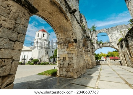 Relics of Spanish colonialism in Cebu,both built in the 1800's from coral stones,the ruins to house Spanish troops,the pretty church still active,a major tourist spot and top heritage site in Oslob.