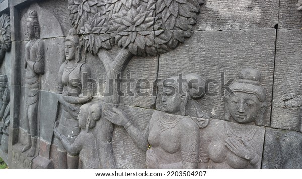 Relief carving of a stone. Relief wall. Stone\
wall decoration.