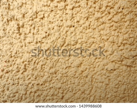 
Relief decorative plaster ocher color. Background structure.					