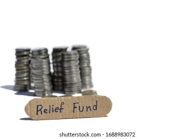 Relief Fund Tag With Heap Of Blurred Coins Money Isolated On White Background With Copy Space For Texts Writing