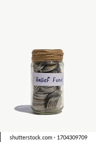 Relief Fund Tag On Glass Jar With Coins Money In Vertical Orientation