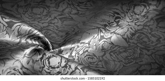 relief pattern, composite textile, silk fabric in black and white, with a floral pattern, unusually pleasant visual sensations: slippery, coolness, softness; beautiful appearance, unique shine