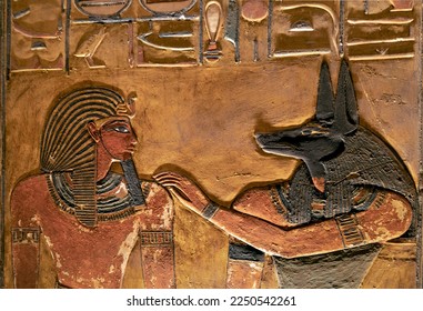 Relief showing Seti first in front of Anubis in his tomb at the Valley of Kings .Luxor . Egypt - Shutterstock ID 2250542261