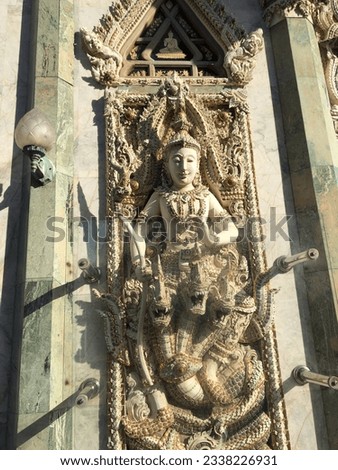 Relief Thai painting angels agora art style design temple religious beautiful Buddha statue snake women man Asia travel culture legend window flame ceremony pray landmark building heritage architectur