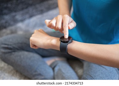 Relieve stress, relax muscles, practice breathing, exercise, meditate. Women exercise using smart watch to record exercise data. - Powered by Shutterstock