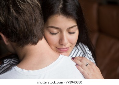 Relieved happy woman hugging man, grateful wife embracing caring loving husband thanking for help support, apology and forgiveness, empathy understanding in relationships concept, close up headshot