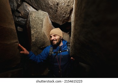 Relieved Man Exiting Cave With Smile On His Face