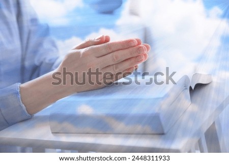 Religion. Double exposure of sky and Christian woman praying over Bible at table, closeup