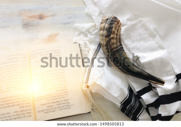 religion image of Prayer\
Shawl - Tallit, Prayer book and Shofar (horn) jewish religious\
symbols. Rosh hashanah (jewish New Year holiday), Shabbat and Yom\
kippur concept.