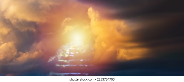 Religion,religious concept,banner background.Sunset with dramatic clouds,blurred stairs to heaven,sunlight from heaven,stairway leading up to skies clouds.Blurred soft focus.Copy space. - Shutterstock ID 2253784703