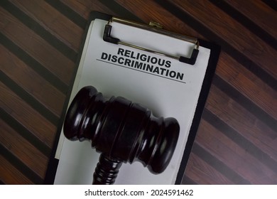 Religious Discrimination Write On A Paperwork Isolated On Wooden Table.