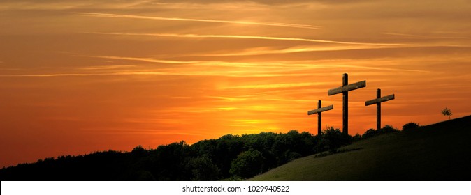 Religious illustration with three backlit crosses with golden glitter and bokeh and nature landscape background. Horizontal composition