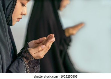 religious islamic background of hands of muslim prayer woman with rosary in dua praying for allah blessing in mosque