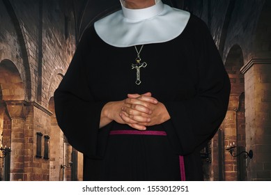 Religious life concept - unrecognized nun prays in the archival medieval monastery (mixed)