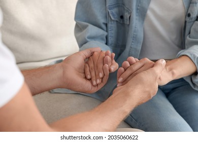 Religious People Holding Hands And Praying Together Indoors, Closeup