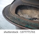 Religious ritual of Burning incense sticks smolder in ritual urn